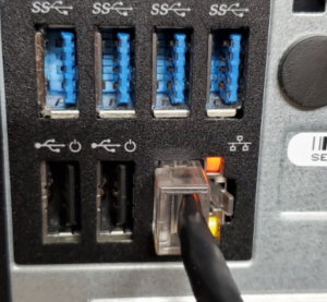 closeup of ethernet port with cable plugged in